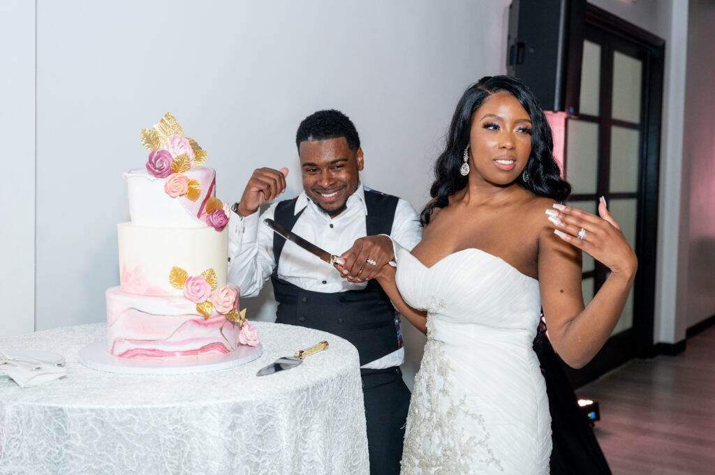 bride and groom cutting their cake at The Sinclair Baltimore Wedding