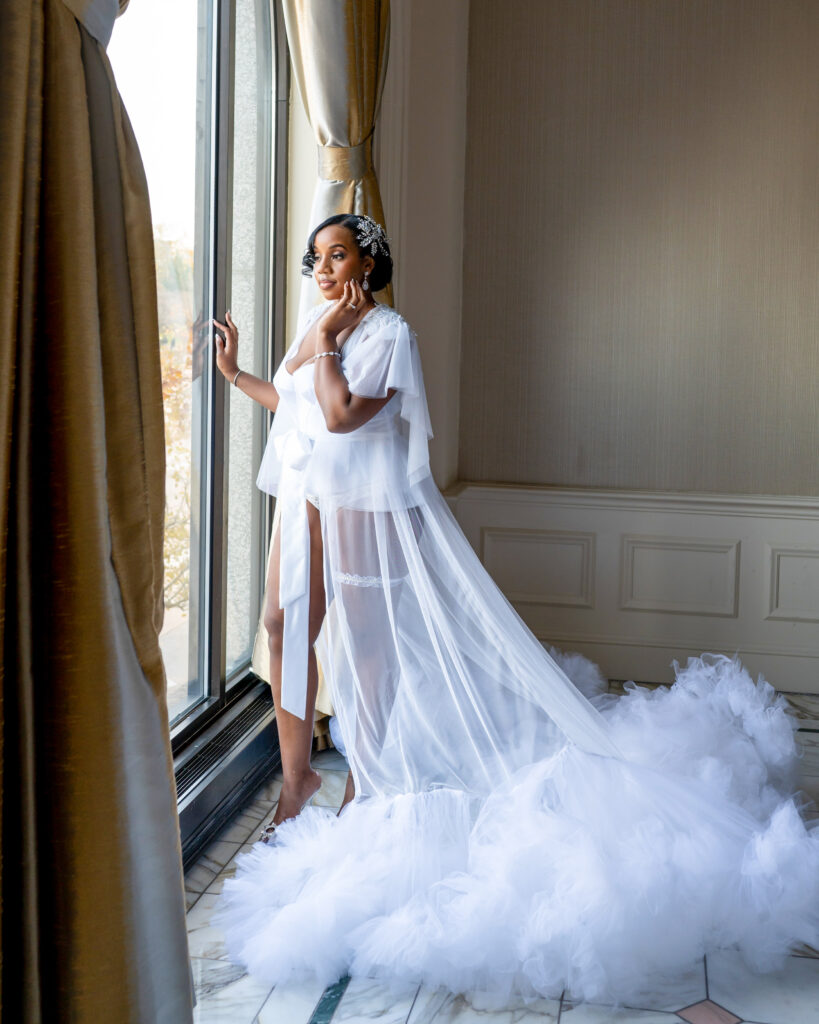 Bride posing near window 